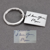 Custom memorial silver key ring, engraved with Mom's actual handwriting, shown with original handwritten words & signature used to personalize it