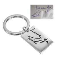 Custom silver key ring, engraved with husband's actual handwriting, shown with original handwritten signature used to personalize it