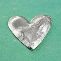 Your child's hand print or footprint etched into a heart pocket token