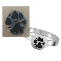 Memorial custom silver paw print jewelry ring, personalized with your pet's actual paw print, shown with the original pawprint