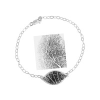 Custom fingerprint petal bracelet in silver, with the fingerprint used to personalize it