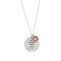 Memorial silver hand stamped necklace shown on white, with a copper and silver heart