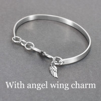 custom Sterling silver handwriting cuff bracelet with clasp, shown from the back, with angel wing charm