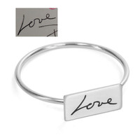 Custom Rectangle Dainty Handwriting Ring, personalized with loved one's actual handwritten word, "Love", shown with original handwriting, from the top on a white background