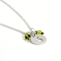 Apple & Peridot Necklace with silver apple teacher gift, from the side on white
