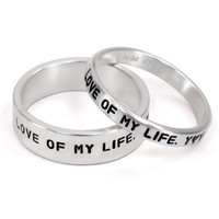 His and Her Personalized Ring Set, with silver rings stamped with your custom message, shown on white