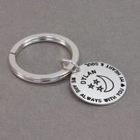 Custom hand stamped silver key chain for kid, personalized with parents' note, shown from the side