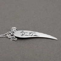 Large Handwriting Memorial Charm Angel Wing in silver, with a silver puffed heart and Sterling Silver Cross with Cut-Out, shown close up from the side