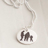 Custom silhouette of 2 parents & 2 kids together, engraved on a sterling silver necklace