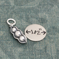 Silver Peas In A Pod Charm, shown close up with a charm for perspective