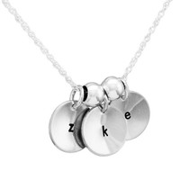 Custom Hand stamped sterling silver discs, personalized with initials, stylishly scooped/cupped for extra dimension, shown on white