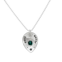 Custom silver Scooped Teardrop with Stone Necklace, personalized with hand stamped names and a star, and a green crystal birthstone, shown on white