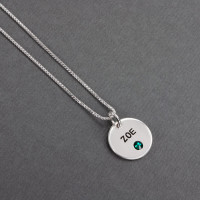 Silver Disc with Crystal Birthstone Necklace, personalized with hand stamped child's name "Zoe" in block upper font, with green birthstone