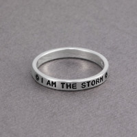 Hand stamped sterling silver stackable rings, personalized with inspirational message, shown from the side