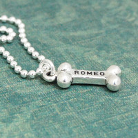 Sterling silver Dog Bone Necklace, shown from the side, with the dog's name stamped on the bone charm
