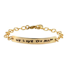 Custom gold signature ID bracelet, personalized with child's handwritten note to mom, shown on white