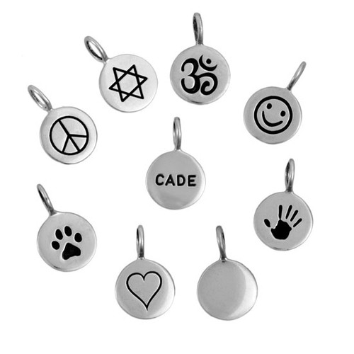 Custom hand stamped symbols on sterling silver on white background