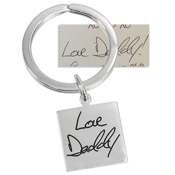 Sterling silver key ring with handwriting etched into the charm, shown with original handwritten note used to create it