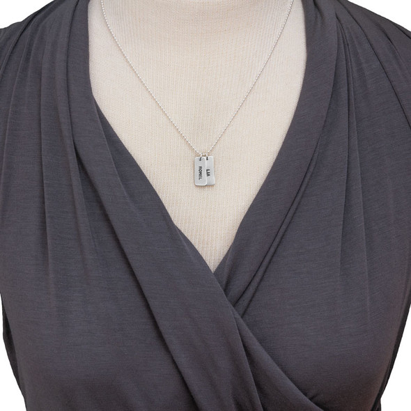 model wearing custom silver Chunky Rectangle Charms Necklace, personalized with hand stamped kids' names