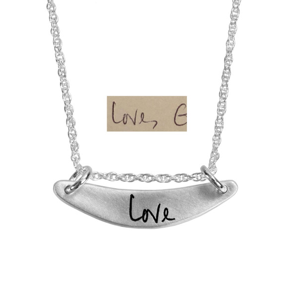 Custom silver arc personalized handwriting necklace, engraved with the word Love, shown with the actual handwriting used to create it  