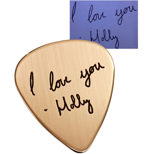 Custom gold guitar pick with your actual handwriting, shown on with original handwriting used to personalize the piece