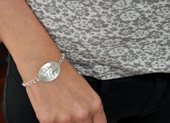 Custom silver handwriting bracelet with actual handwriting shown on model