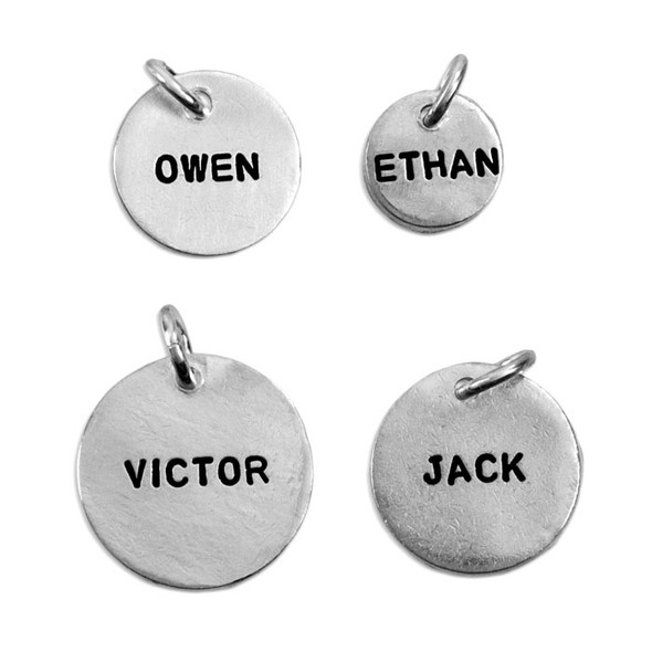 Four sizes of Thai personalized hand stamped fine silver harms, shown on white