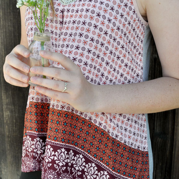 Hand crafted silver ring with two hearts, shown on model hand