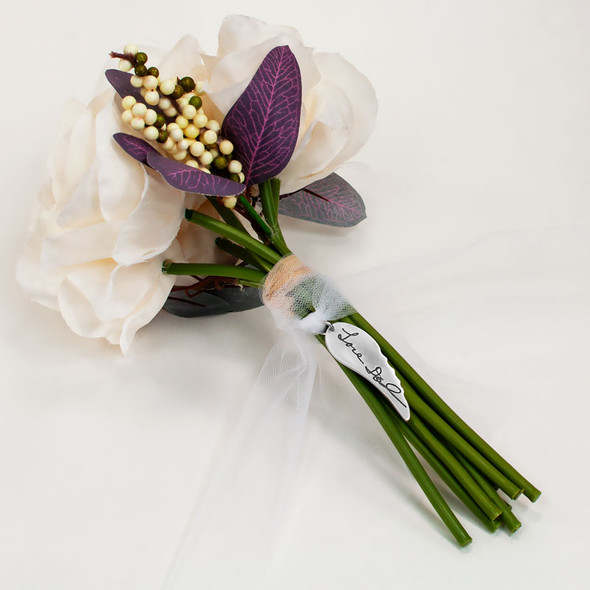 Memorial silver Angel wing bouquet charm engraved with actual handwritten signature from Dad, shown on bouquet