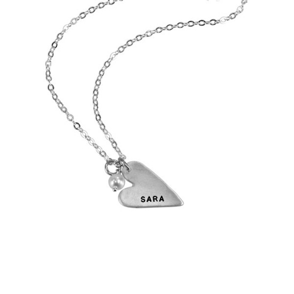 handmade long silver heart charm, hand stamped with a name, hung with a pearl , on a silver chain, shown on a white background