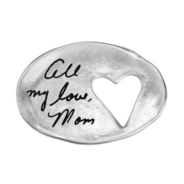 A custom Heart Cutout Handwriting Pocket Token, personalized with mom's signature, made from fine pewter,  and shown on white