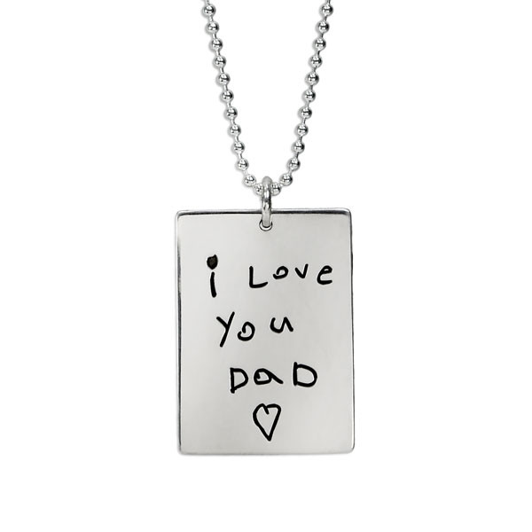 Custom silver necklace personalized with kid's handwritten note on rectangle tag for man or woman, shown close up on white