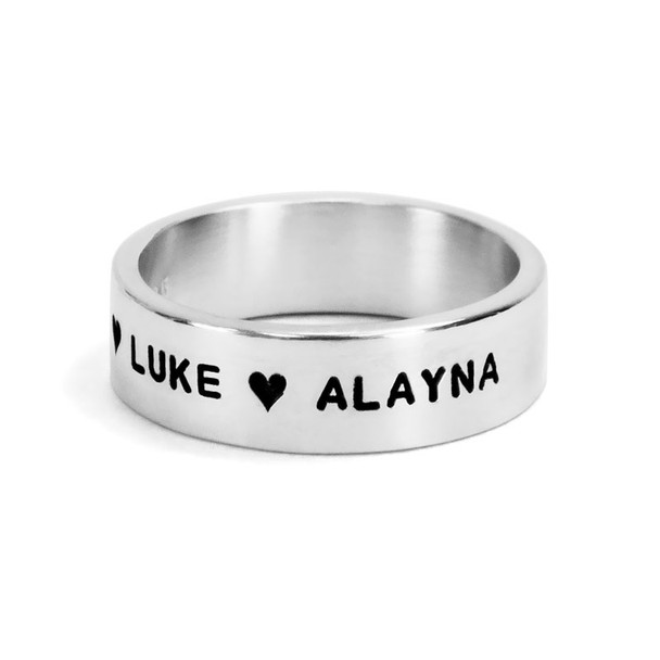 Custom Hand stamped sterling silver wide band ring, personalized with kids names and a heart, shown close up on white