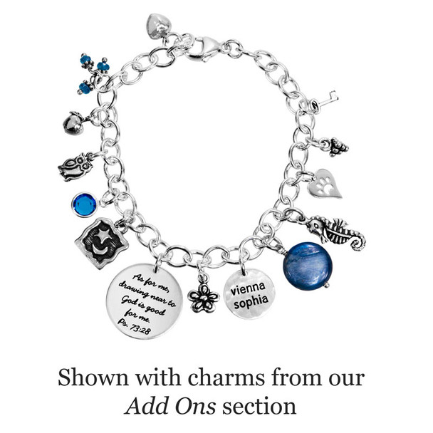 Lots of charms added to Your Saying On A Bracelet, made with sterling silver and personalized with your message, which is hand stamped on the charm