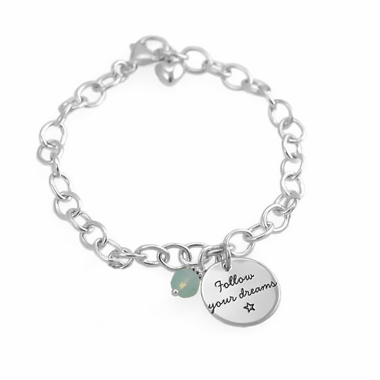 Custom Your Saying On A Bracelet in sterling silver, personalized with your message hand stamped on the charm, shown on white