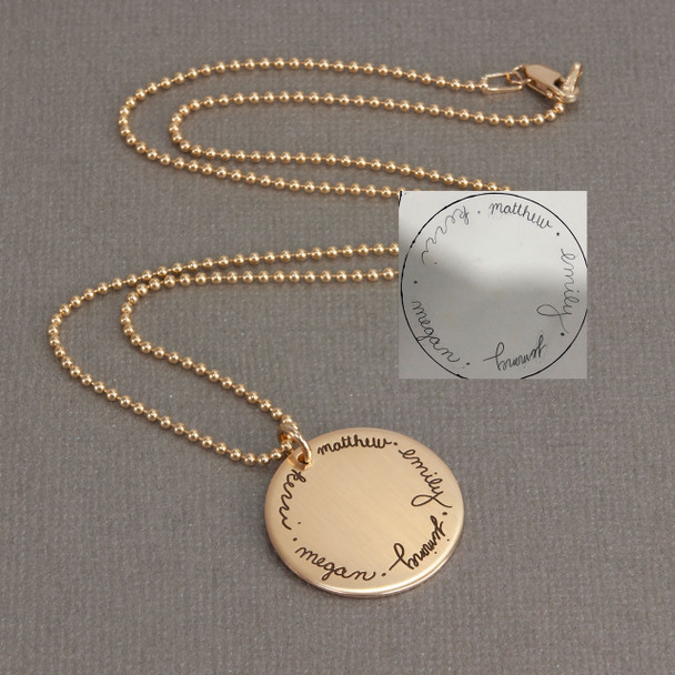 Custom gold disc handwriting necklace, personalized with signatures of kids arranged in a circle, shown with original handwriting