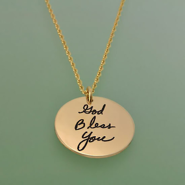 Side view of custom gold disc handwriting memorial necklace, personalized with God Bless You in grandma's handwriting