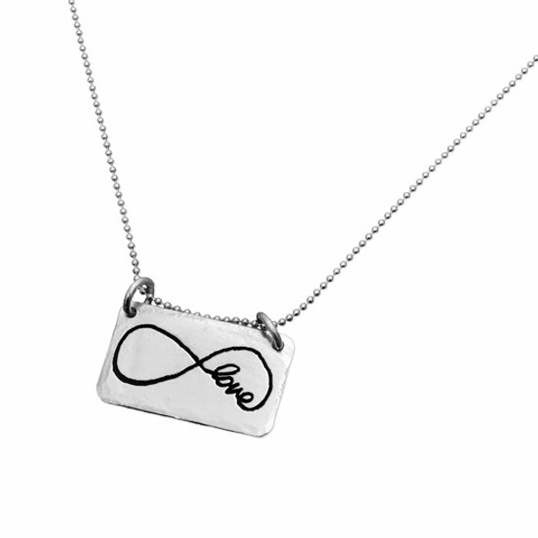 Sterling silver rectangle jewelry made from handwriting, with infinity loop and the word Love, shown on white