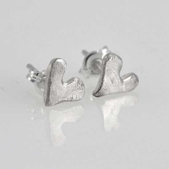 "Loved" handmade fine silver heart earrings, shown from the side