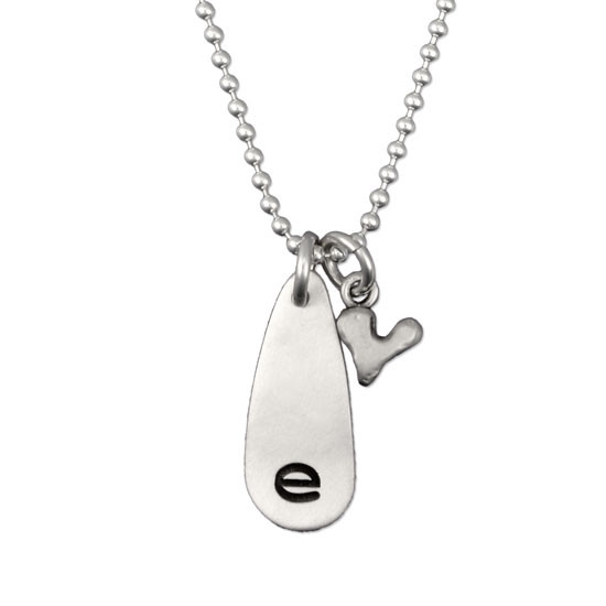 E stamped on tear drop charm