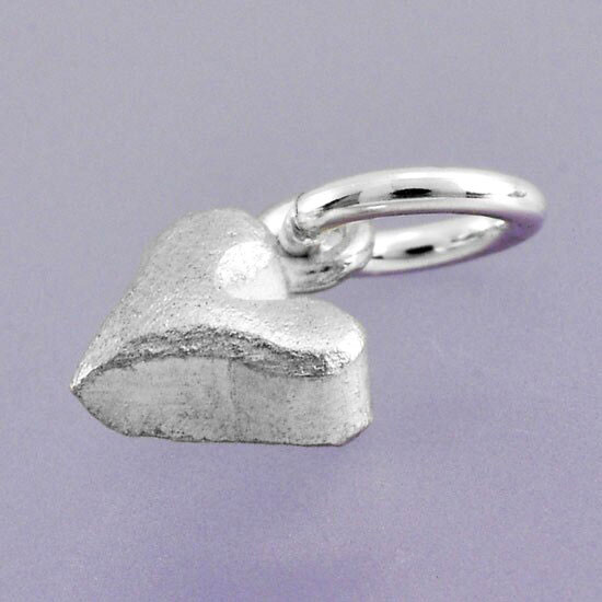 fine silver Sideways Sculpted Heart Charm, shown from the side