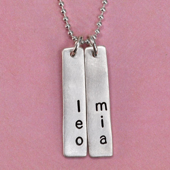 Custom sculpted silver long rectangle, personalized with hand stamped kids' names, stamped lengthwise