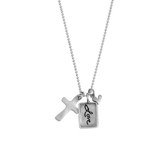 Silver charm with raised edge & the handwritten word Love, with a fine silver cross and fine silver heart, shown on white