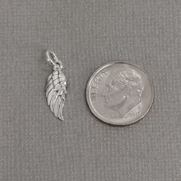 Silver Angel wing to add to your hand stamped or handwriting memorial necklace or bracelet, shown next to a dime
