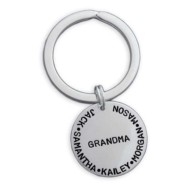 Silver custom hand stamped key ring for grandma with grandkids' names, shown on white