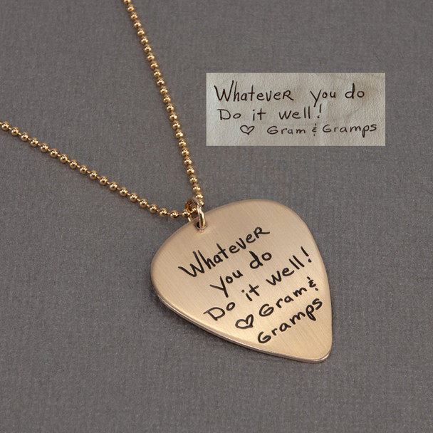 Custom memorial gold guitar pick necklace with handwritten not from Grampa, shown on with original handwriting used to personalize the piece