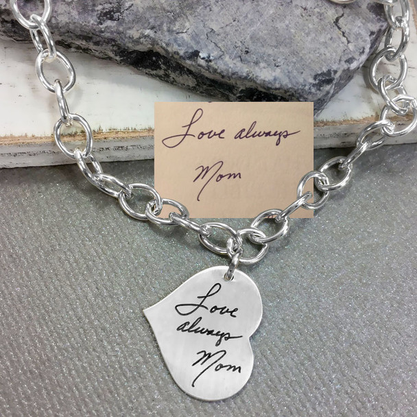 Small Silver Handwriting Heart Bracelet, shown with original handwritten note used to make it