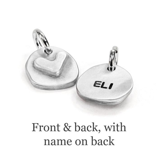 handmade silver heart charm with heart, showing front, and also name "Eli" stamped on back of charm
