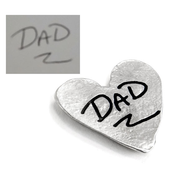 Fine pewter handwriting heart pocket charm, shown with  handwritten signature used to personalize it, shown from the side