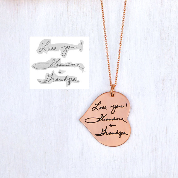 Rose Gold Heart Handwriting Necklace on white wood background, showing Love You Grandma & Grandpa